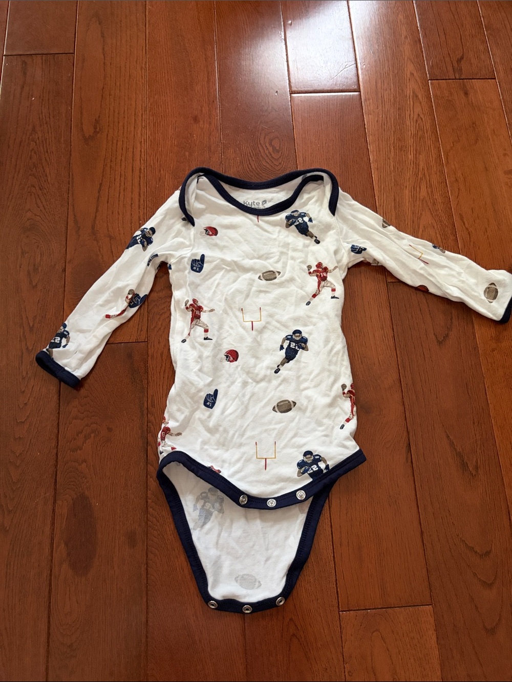 Kyte BABY White Football-Print Long Sleeve One-Piece with Navy Trim